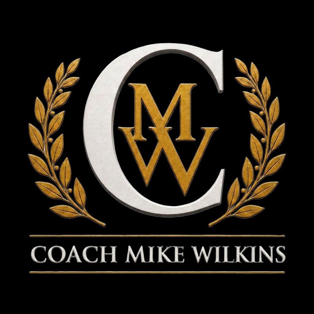 Coach Mike Wilkins gold laurel crest logo